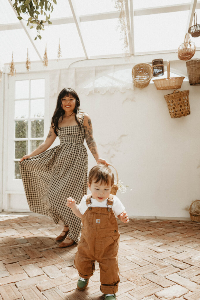Close-up of a flowing cotton dress catching golden light, perfect outfit for a cinematic motherhood session.