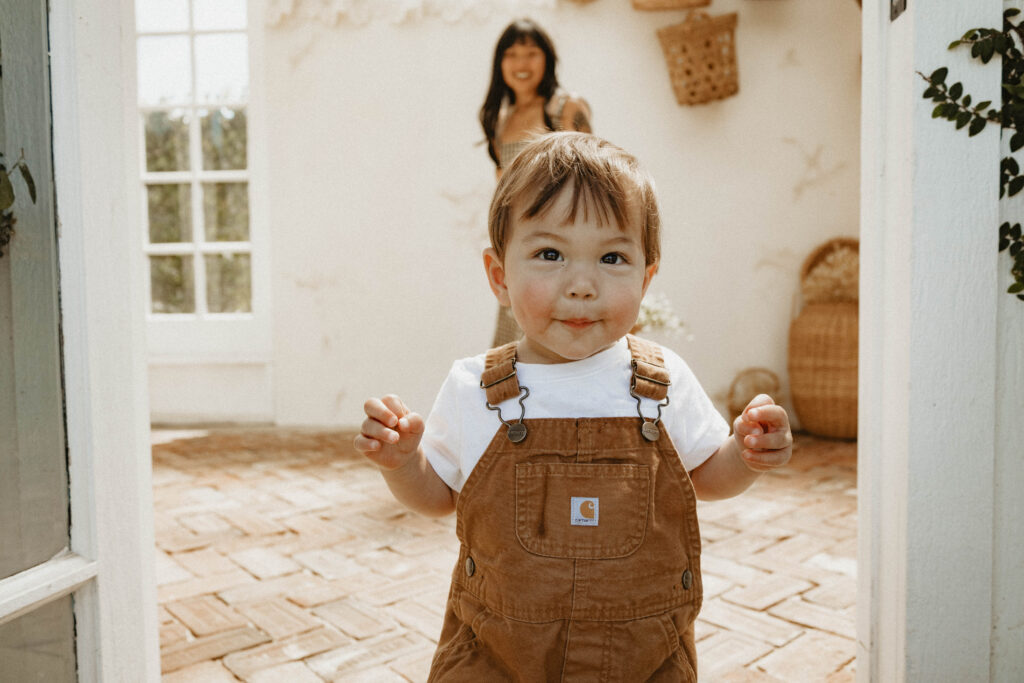 Close-up of a flowing cotton dress catching golden light, perfect outfit for a cinematic motherhood session.