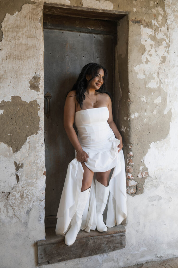 future bride taking western style engagment photos at san juan capistrano mission