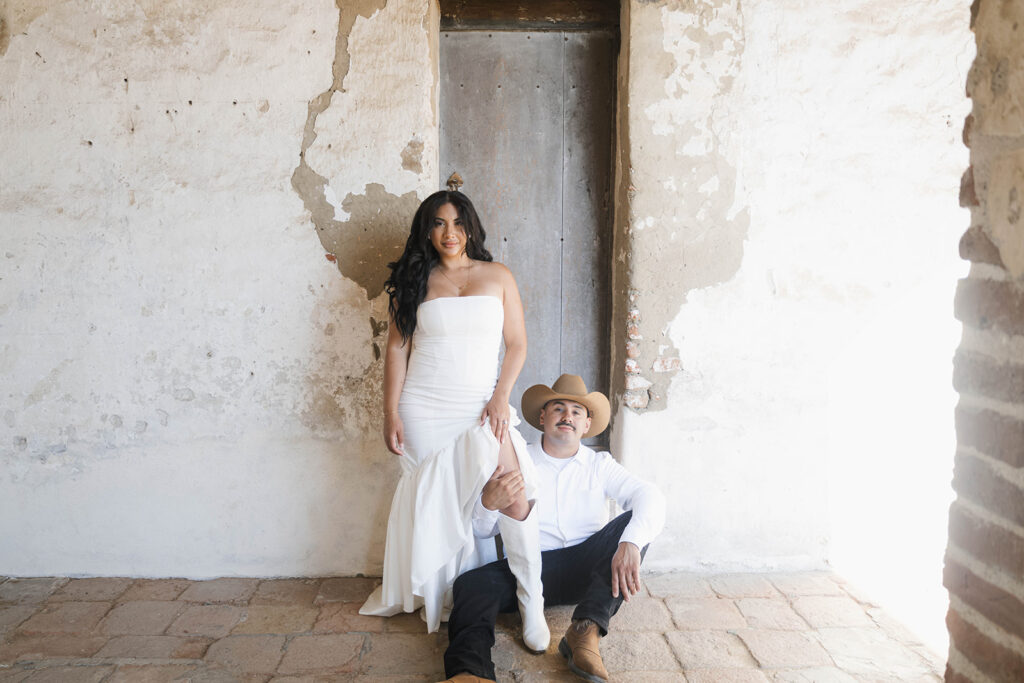 fiance with groom to be in front of historic architecture