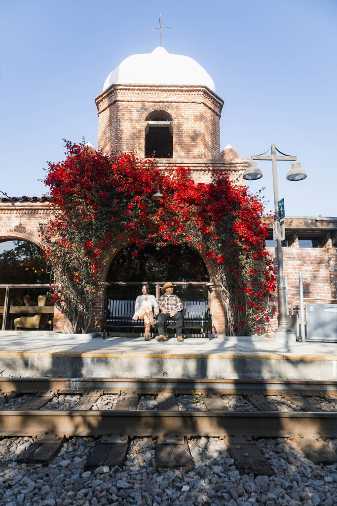 San Juan Capistrano engagement shoot with future bride and groom taking western style engagment photos at san juan capistrano mission