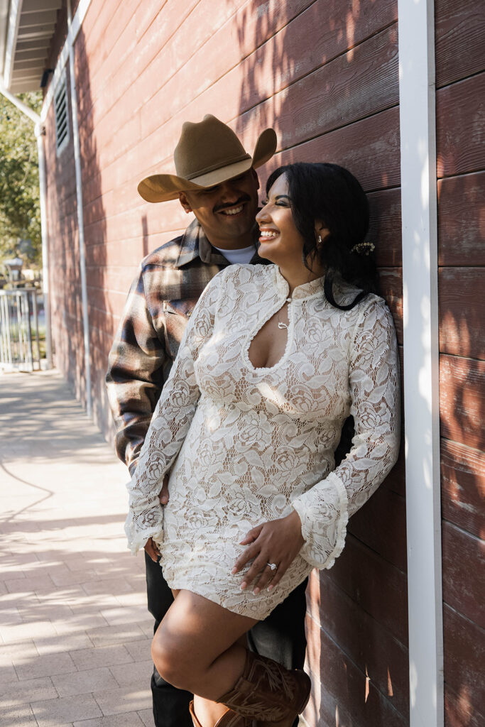 future bride and groom taking western style engagment photos