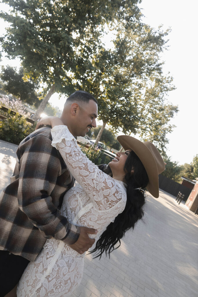 future bride and groom taking western style engagment photos
