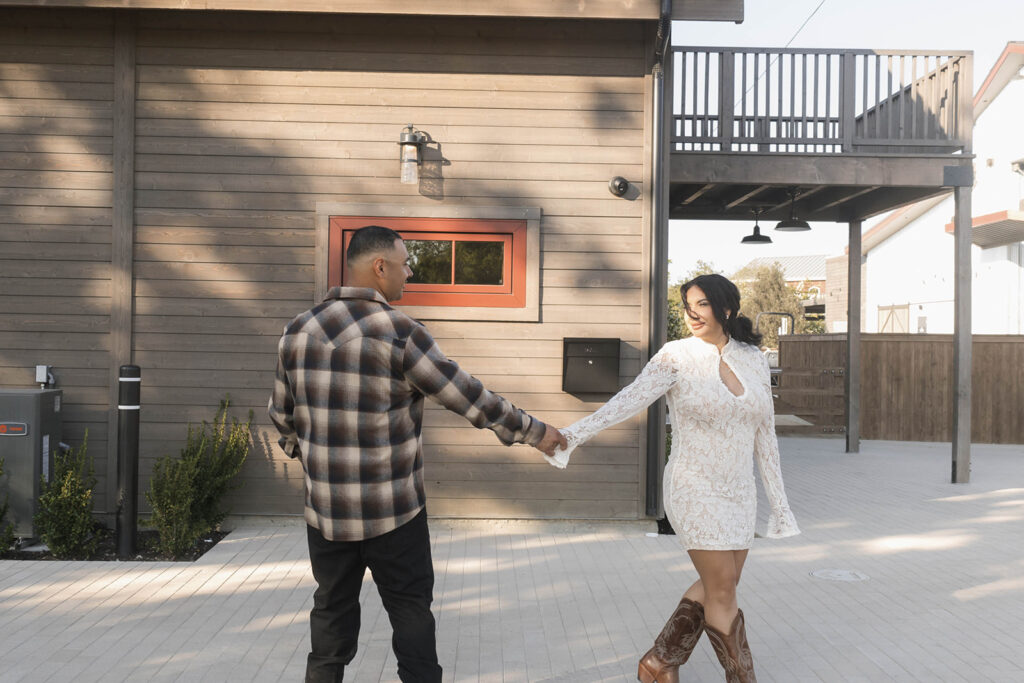 future bride and groom taking western style engagment photos