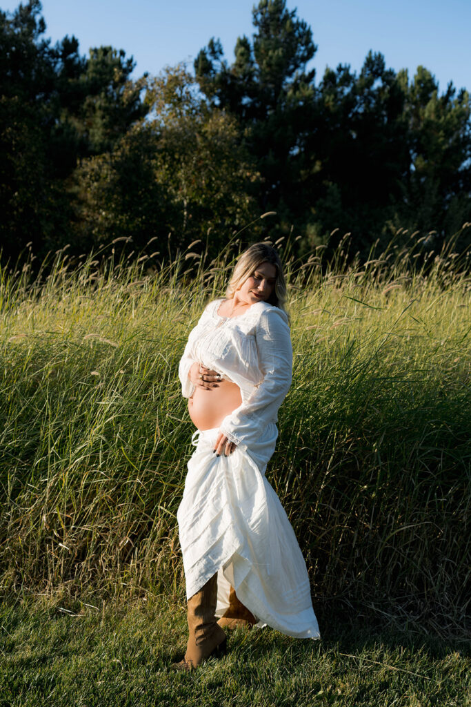 Orange County maternity photographer capturing organic couples maternity session in tall grass with expecting parents