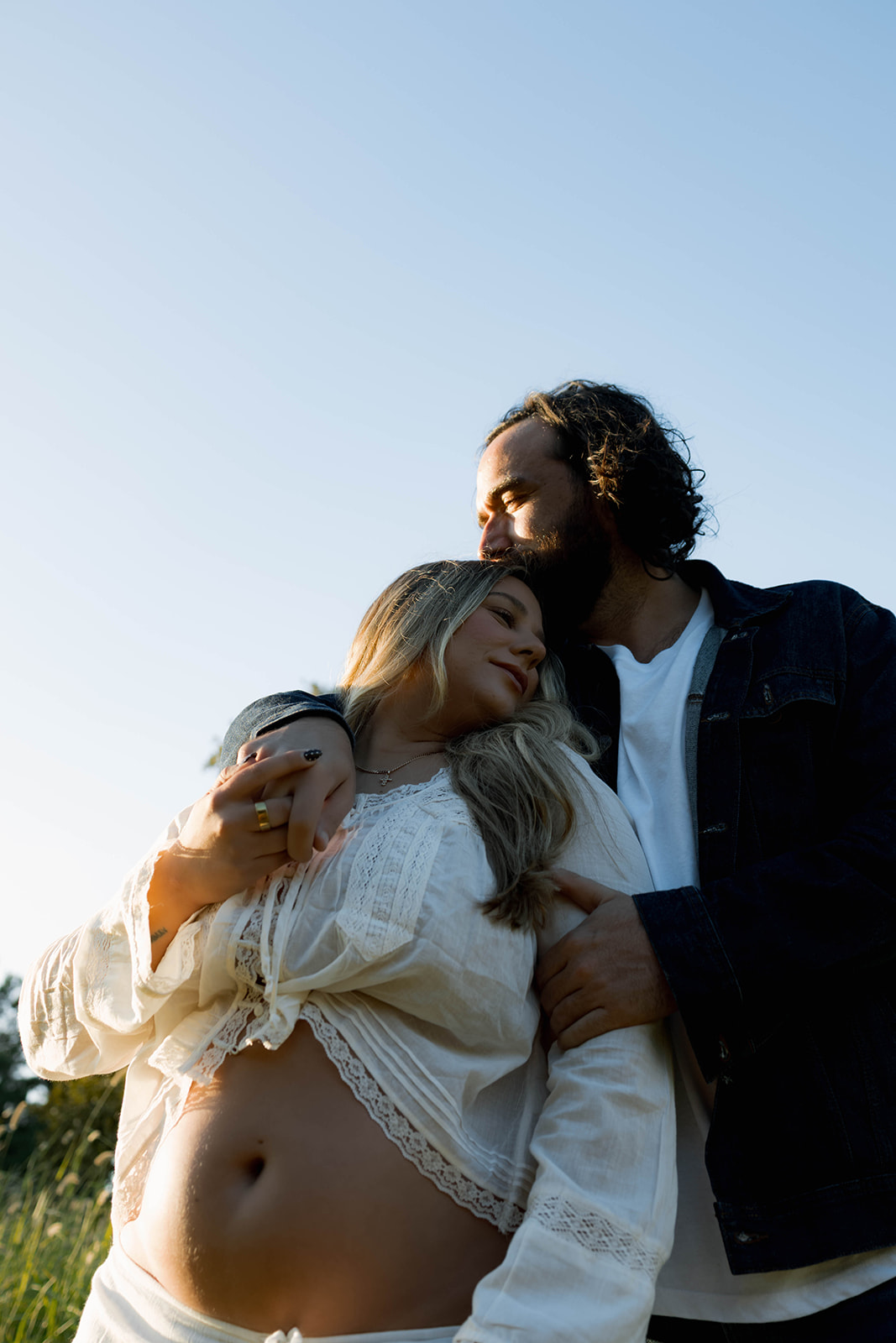 Orange County maternity photographer capturing organic couples maternity session in tall grass with expecting parents