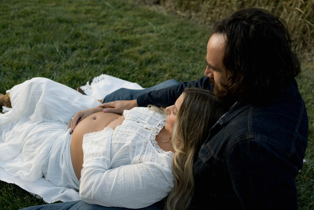 Orange County maternity photographer capturing organic couples maternity session in tall grass with expecting parents