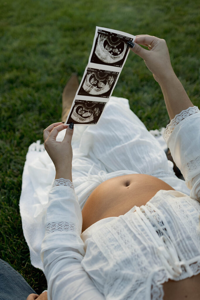 Orange County maternity photographer capturing organic couples maternity session in tall grass with expecting parents