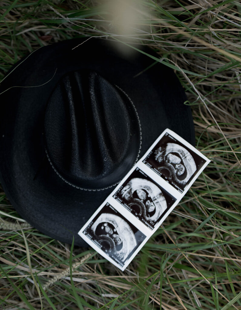 Orange County maternity photographer capturing organic couples maternity session in tall grass with expecting parents