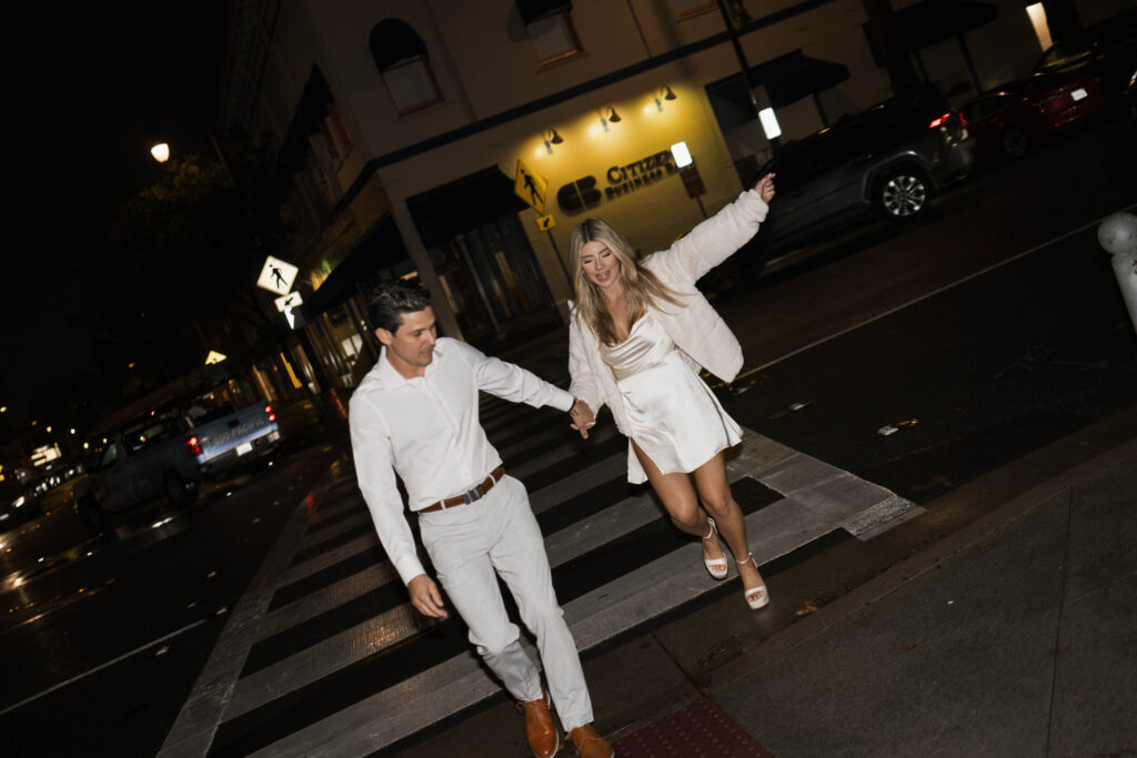 Historic Orange street reflections during a rainy engagement session with cinematic atmosphere
