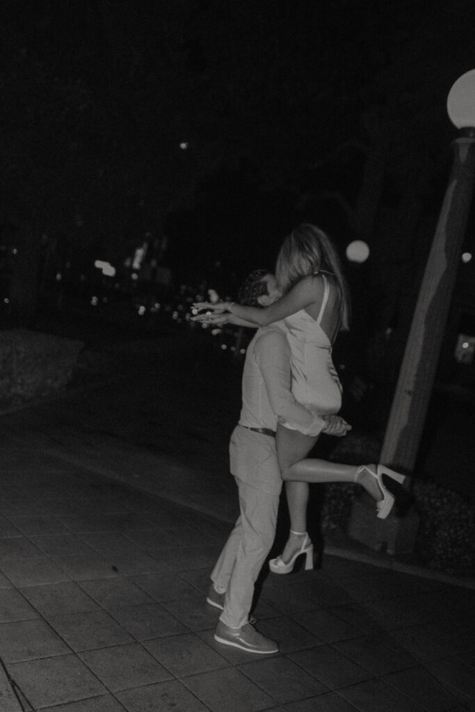 Historic Orange street reflections during a rainy engagement session with cinematic atmosphere