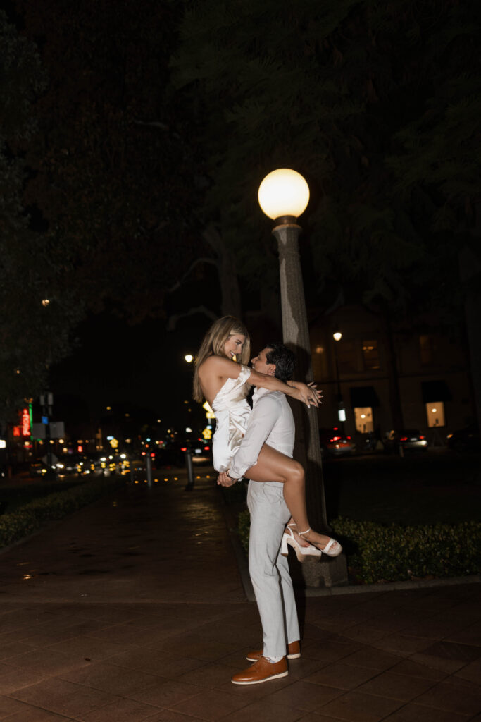 Historic Orange street reflections during a rainy engagement session with cinematic atmosphere
