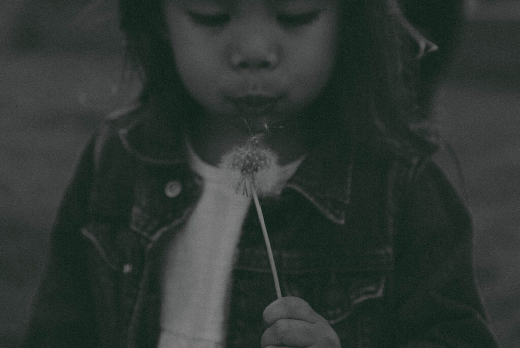 Young family of five standing in front of their forever home during an Orange County in-home family photography session