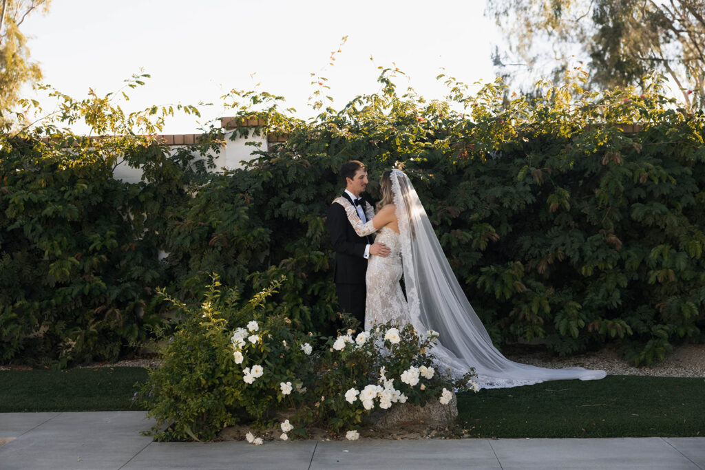 Bride and groom posing for wedding portraits.