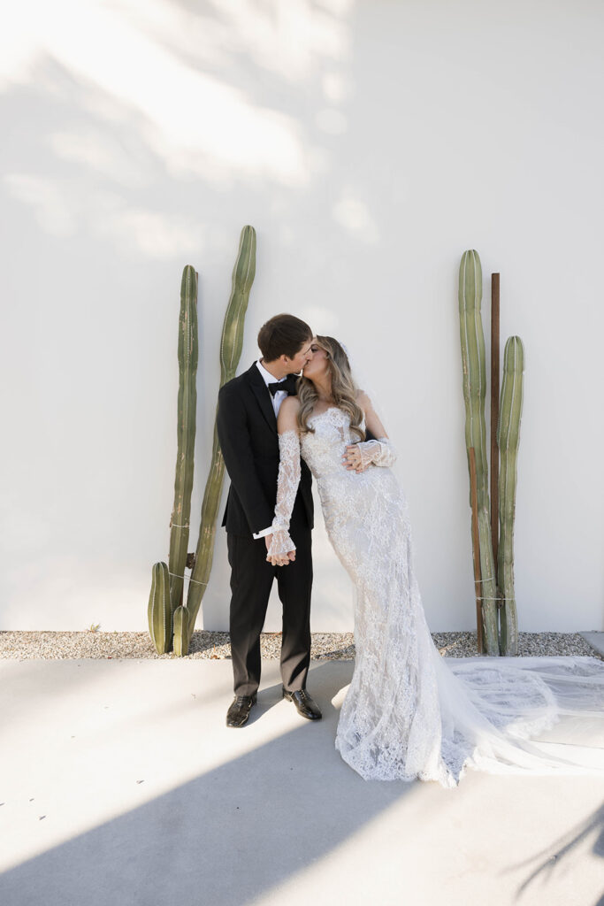 Bride and groom posing for wedding portraits.
