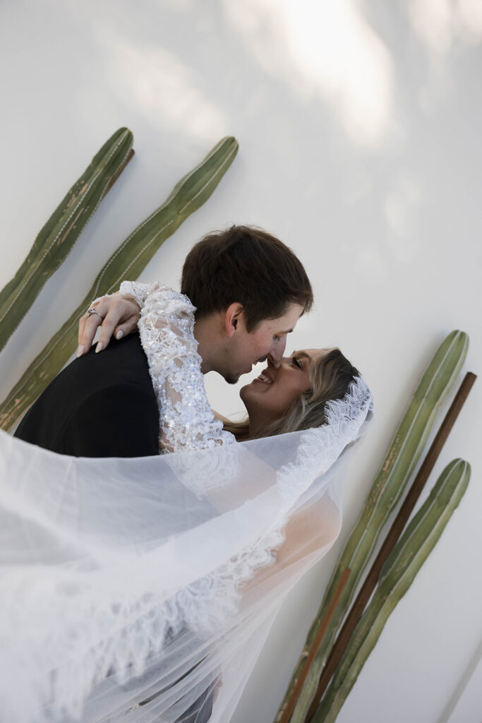 Bride and groom posing for wedding portraits.