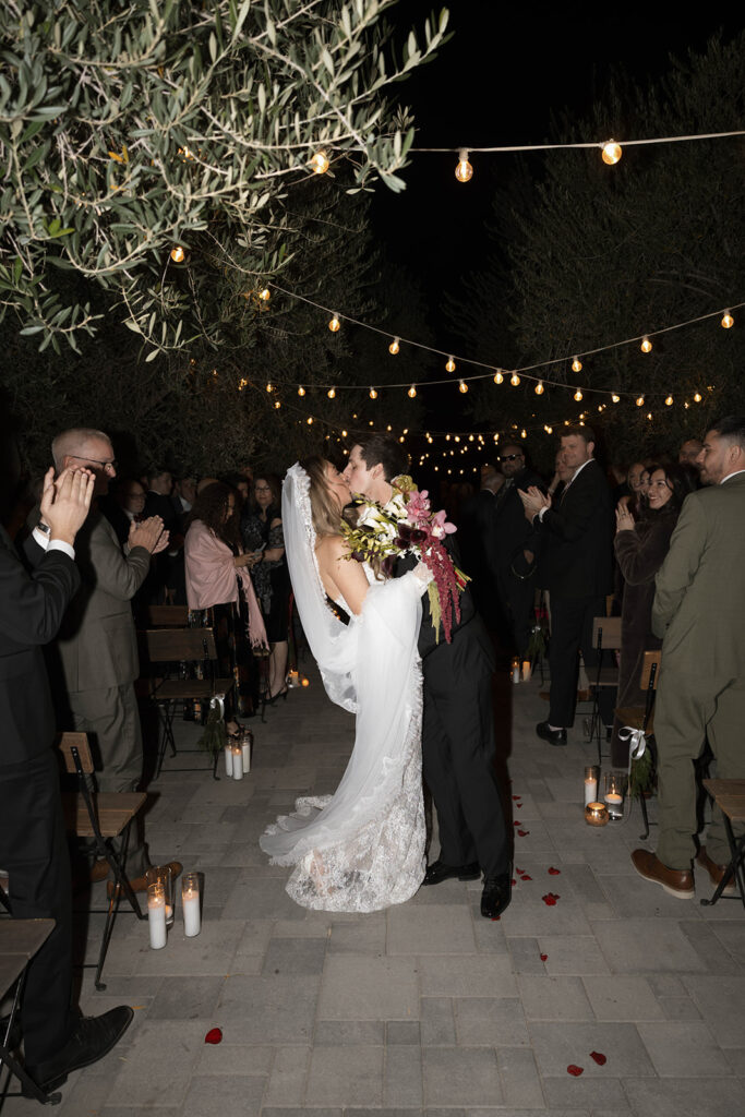 Bride and groom posing for wedding portraits.