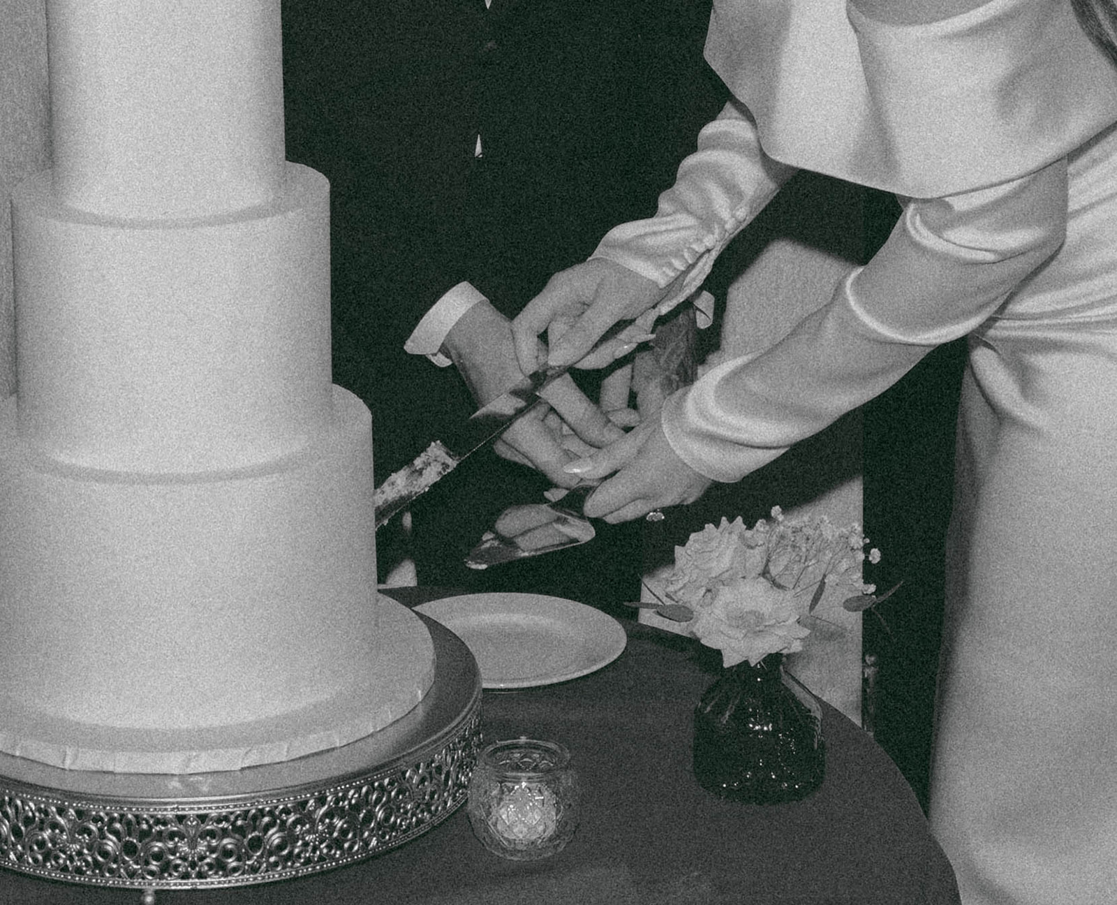 Bride and groom at a vintage-inspired wedding cutting cake