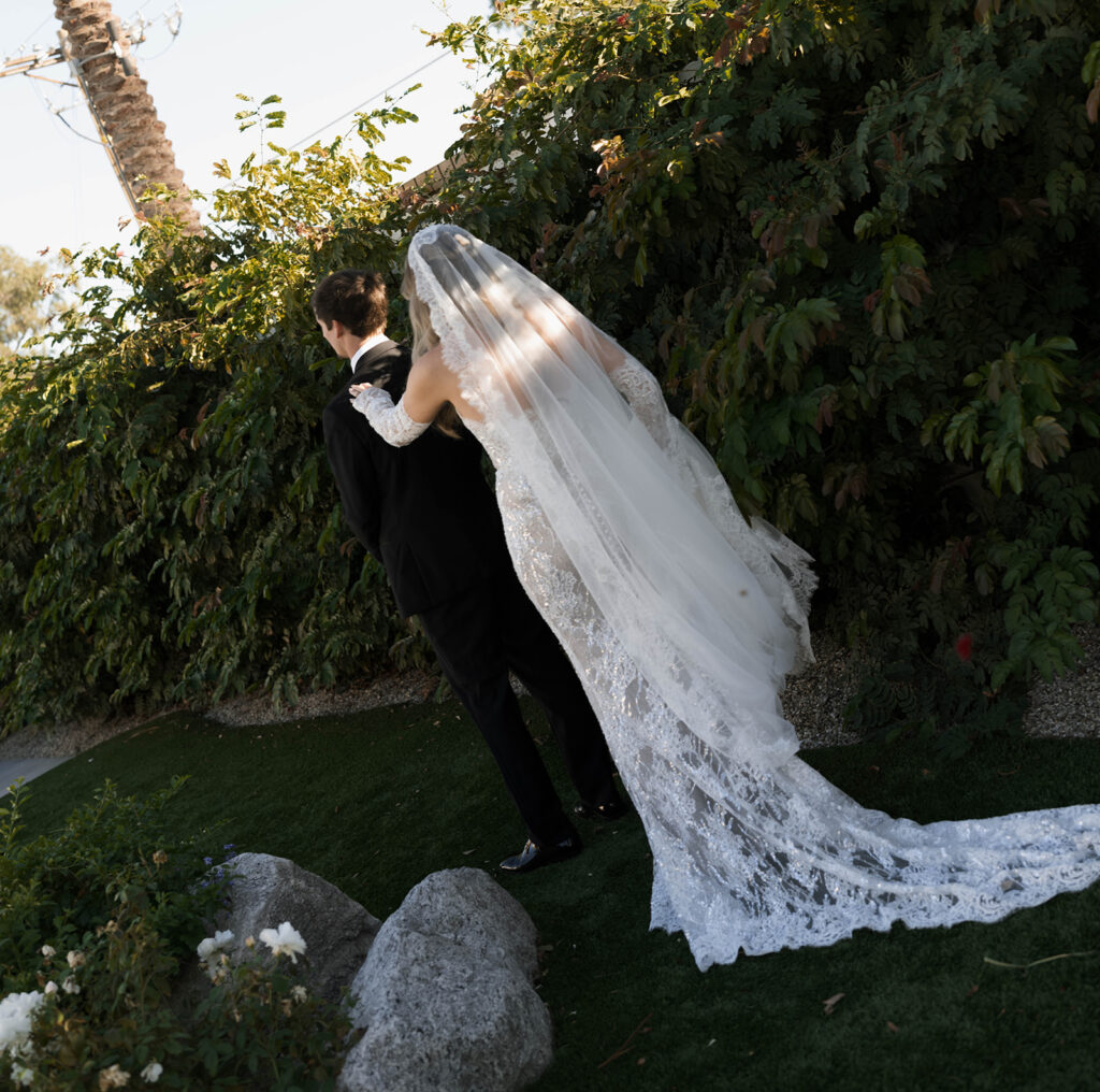 Bride and groom posing for wedding portraits.