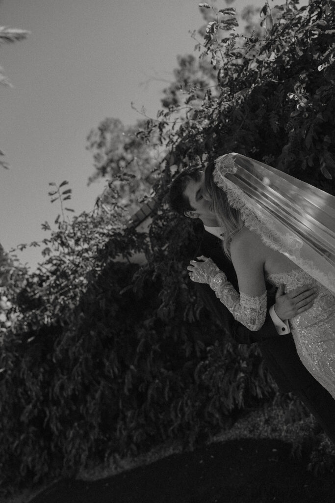 Bride and groom posing for wedding portraits.
