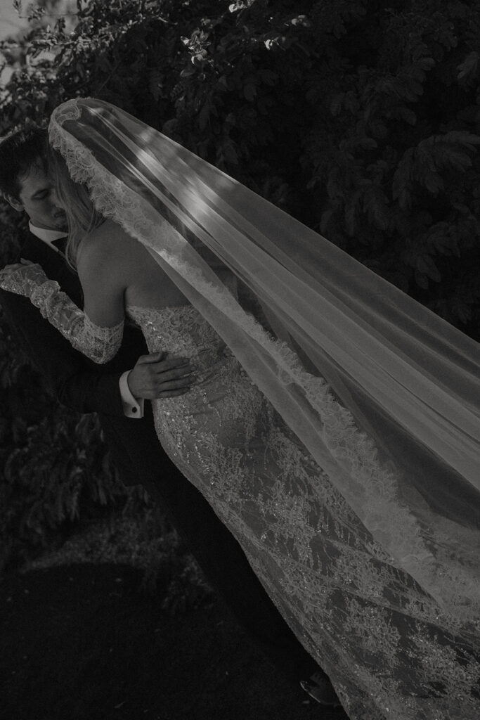 Bride and groom posing for wedding portraits.