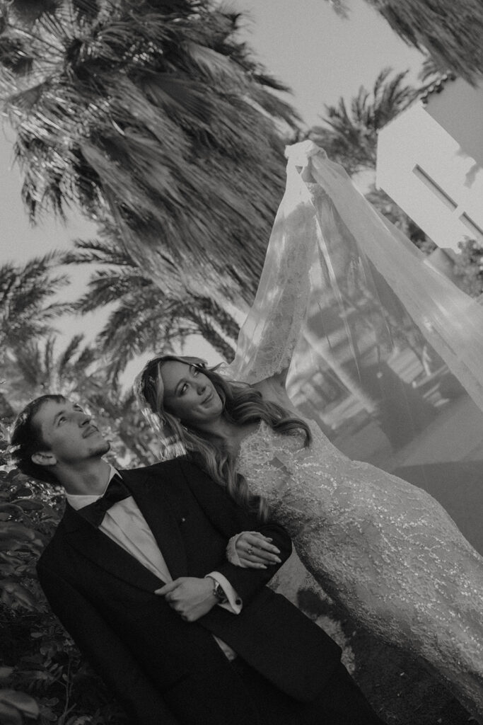 Bride and groom posing for wedding portraits.