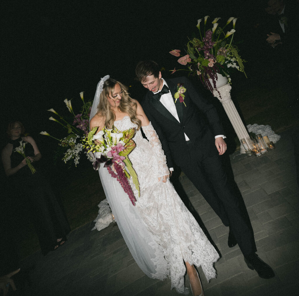 Bride and groom posing for wedding portraits.