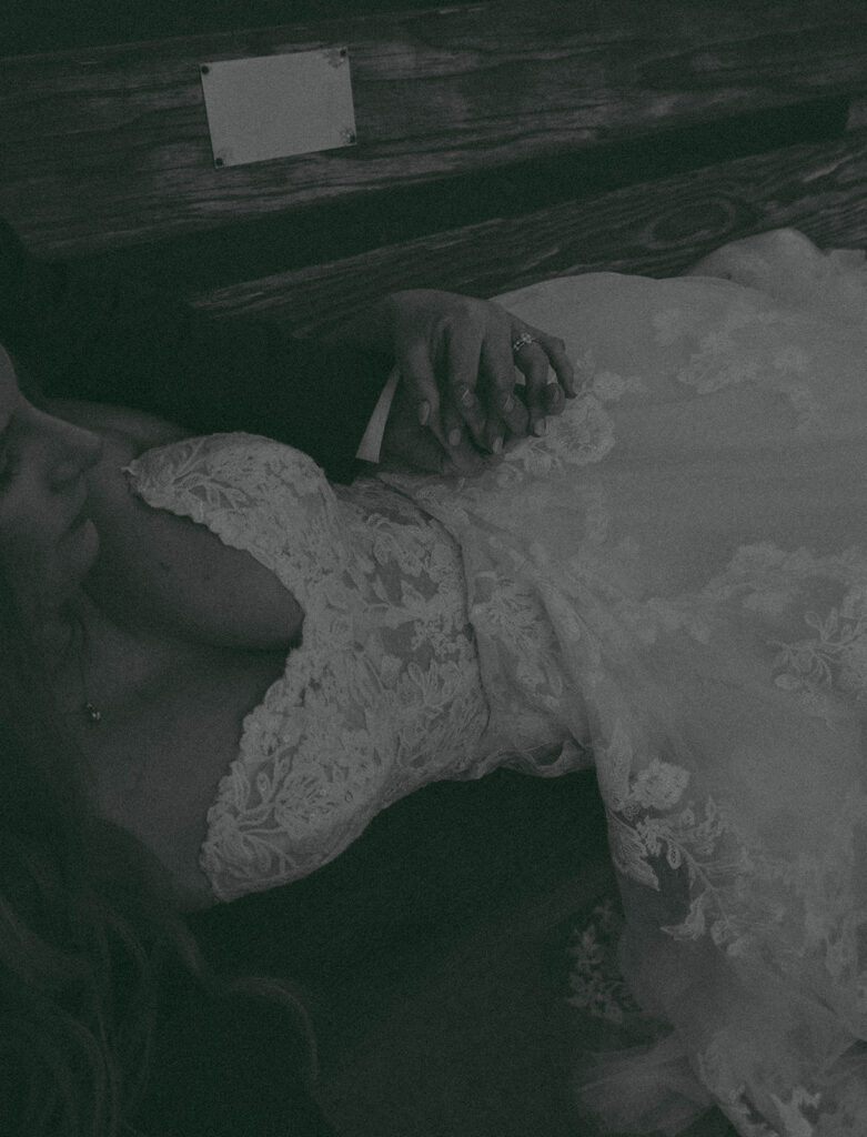 Intimate beach elopement ceremony with family gathered on a cliffside