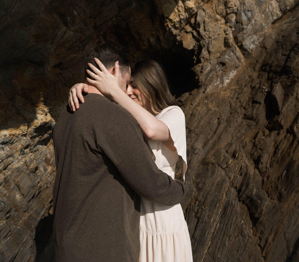 Cinematic film inspired engagement photos in Laguna Beach with Arizona couple in neutral outfits