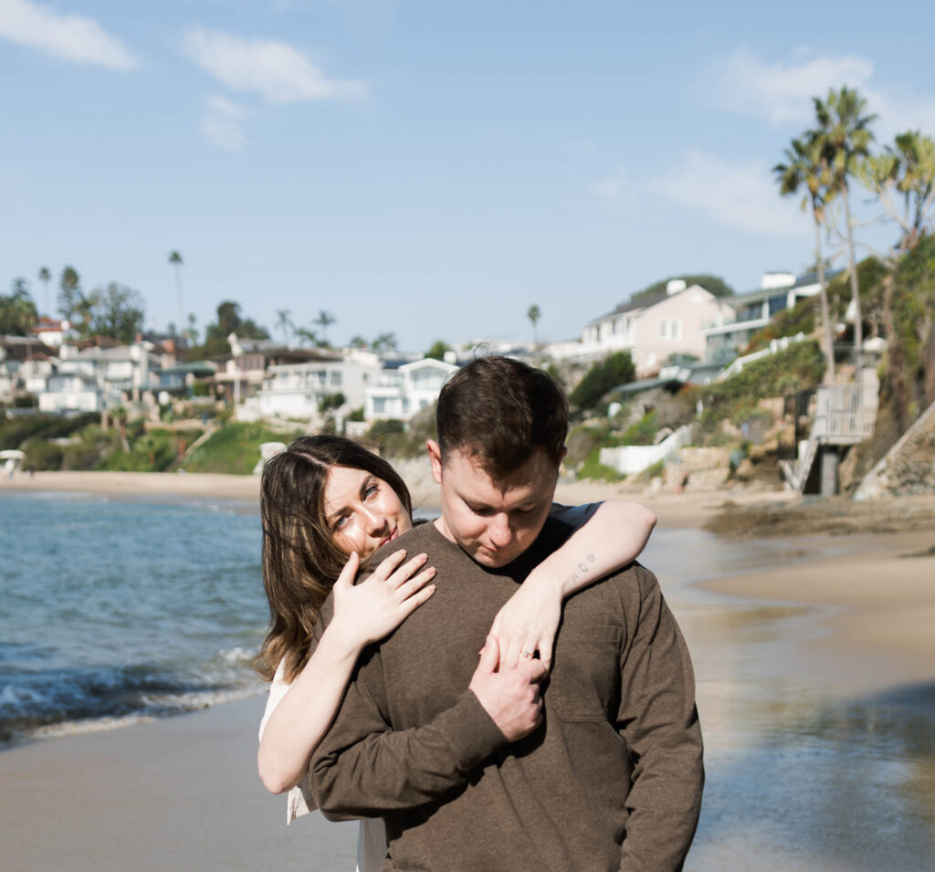 Cinematic film inspired engagement photos in Laguna Beach with Arizona couple in neutral outfits