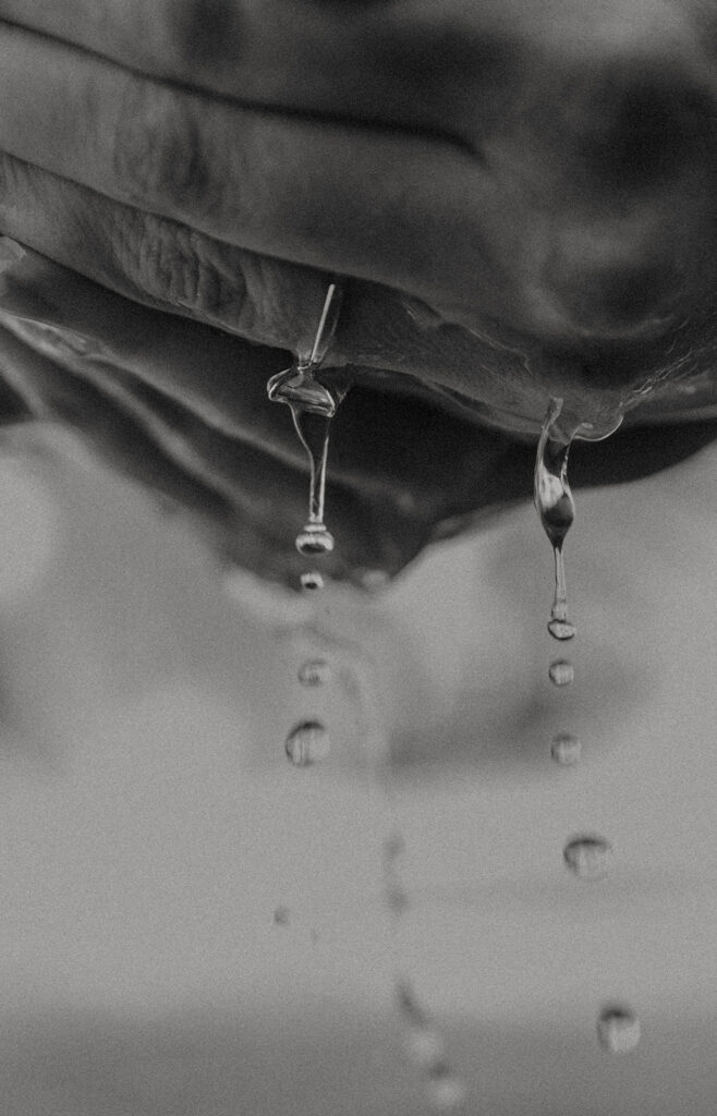 Cinematic film inspired engagement photos in Laguna Beach with Arizona couple in neutral outfits