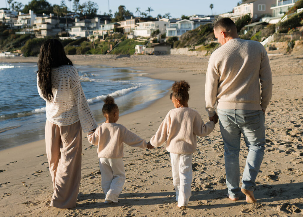 family photoshoot on the beach at sunset