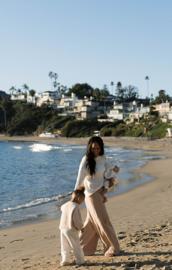 family photoshoot on the beach at sunset