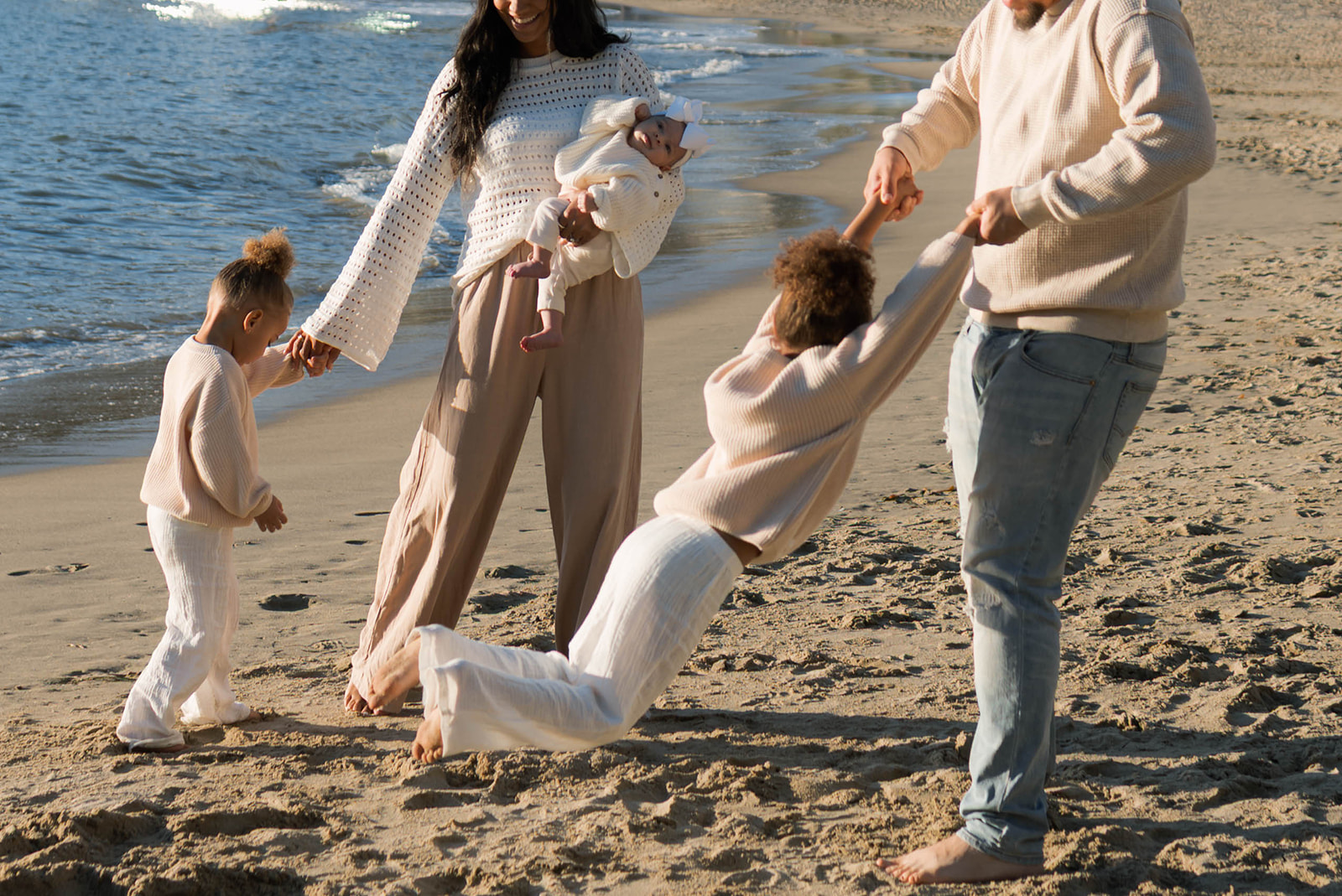 Family photography session on the beach in Laguna Beach at sunset
