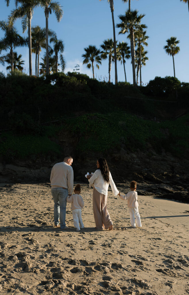 family photoshoot on the beach at sunset