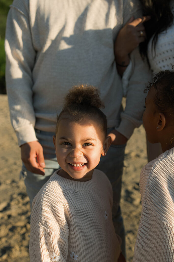 family photoshoot on the beach at sunset