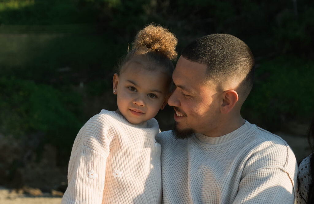 family photoshoot on the beach at sunset