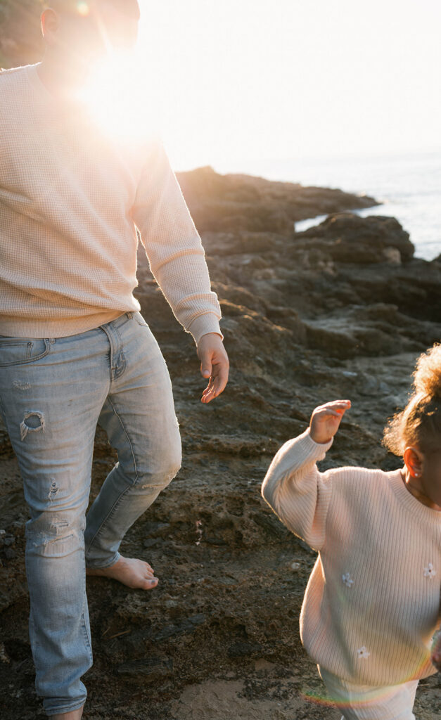 family photoshoot on the beach at sunset
