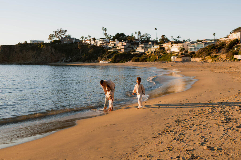 family photoshoot on the beach at sunset