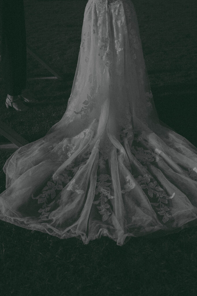 Intimate beach elopement ceremony with family gathered on a cliffside