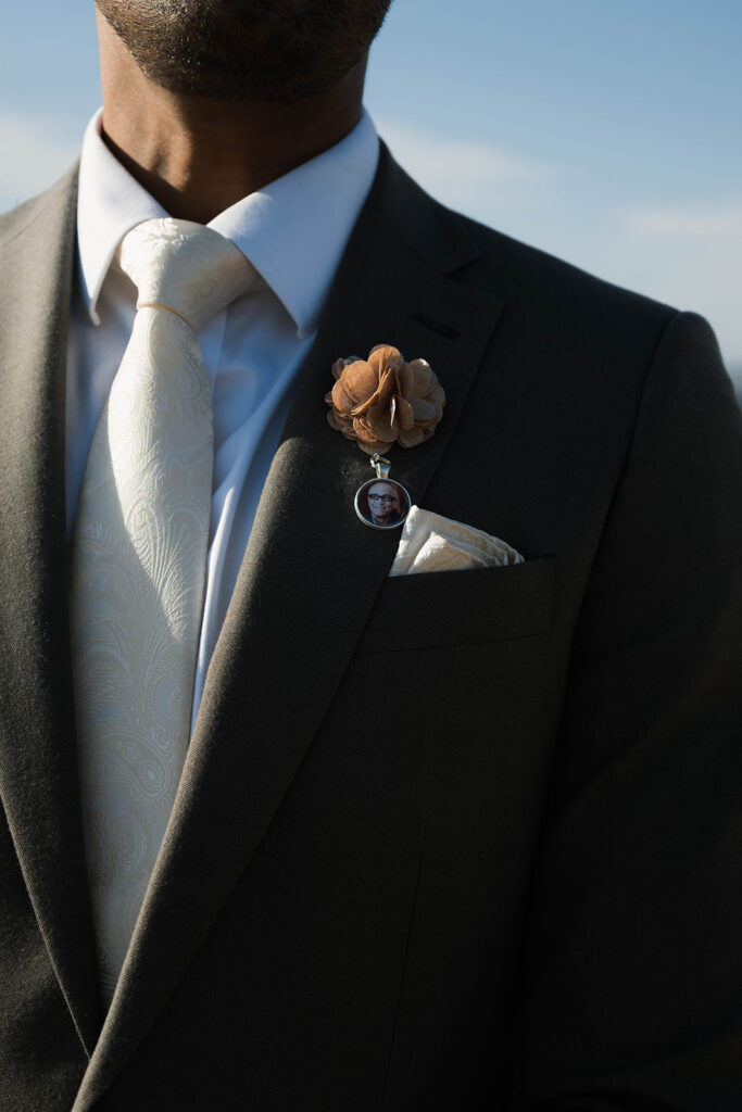 Intimate cliffside elopement ceremony overlooking the ocean at sunset