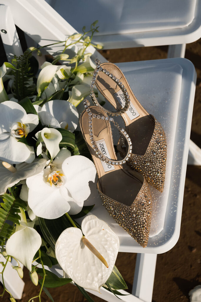 Intimate cliffside elopement ceremony overlooking the ocean at sunset