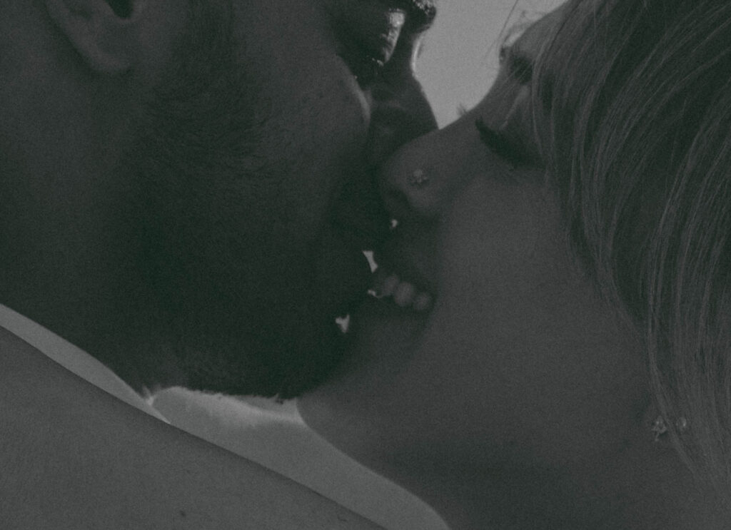 Intimate cliffside elopement ceremony overlooking the ocean at sunset