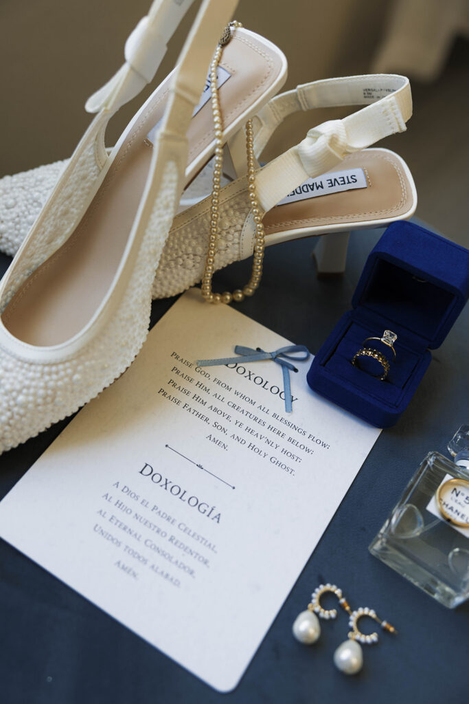 Romantic wedding scene featuring soft pastel florals, elegant decor, emotional couple moments, and guests celebrating in a light-filled venue inspired by Monet’s water lily paintings.