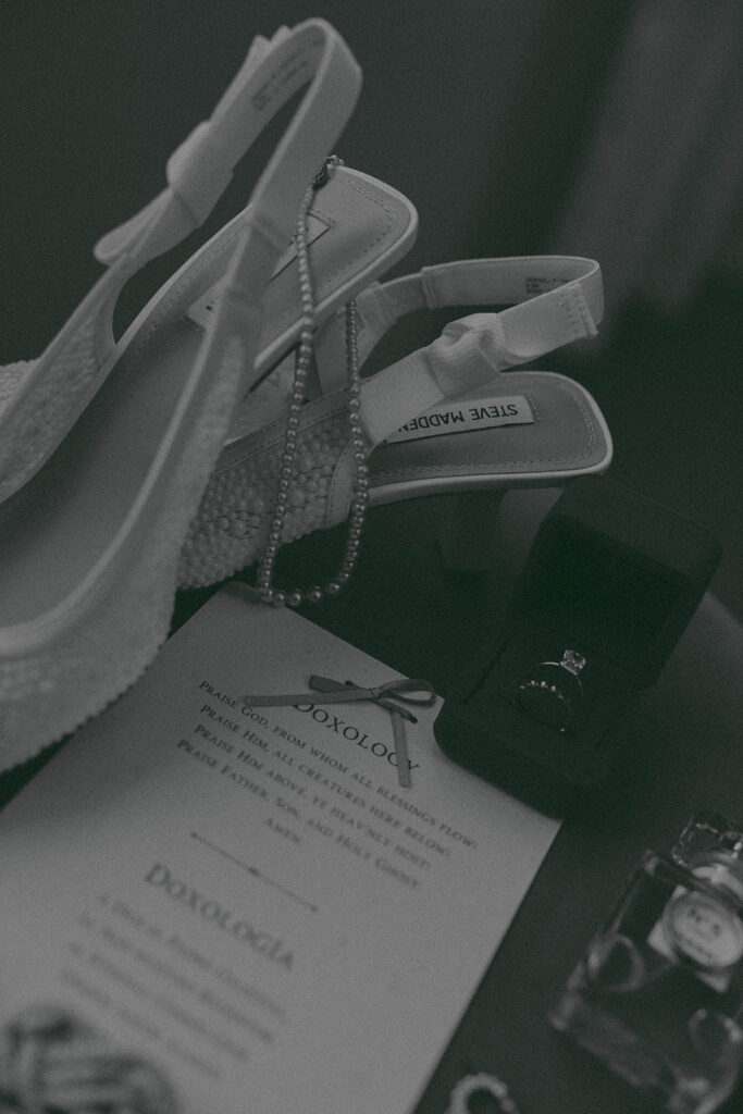 Romantic wedding scene featuring soft pastel florals, elegant decor, emotional couple moments, and guests celebrating in a light-filled venue inspired by Monet’s water lily paintings.