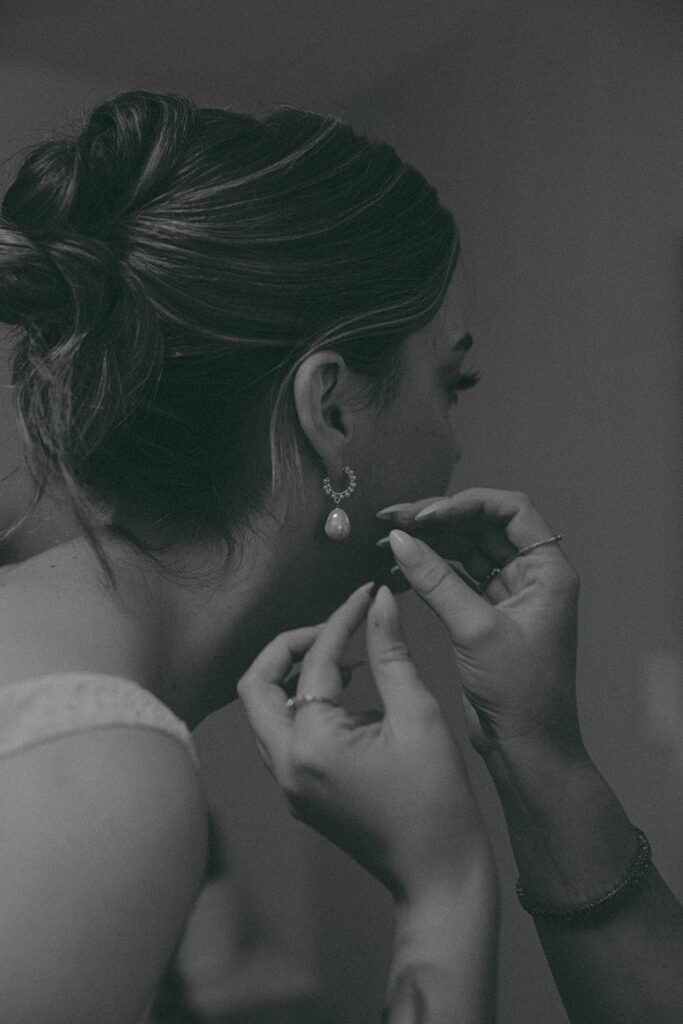 Romantic wedding scene featuring soft pastel florals, elegant decor, emotional couple moments, and guests celebrating in a light-filled venue inspired by Monet’s water lily paintings.