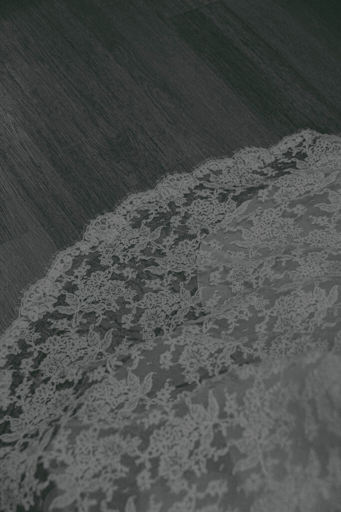 Romantic wedding scene featuring soft pastel florals, elegant decor, emotional couple moments, and guests celebrating in a light-filled venue inspired by Monet’s water lily paintings.