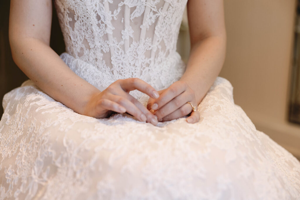 Romantic wedding scene featuring soft pastel florals, elegant decor, emotional couple moments, and guests celebrating in a light-filled venue inspired by Monet’s water lily paintings.