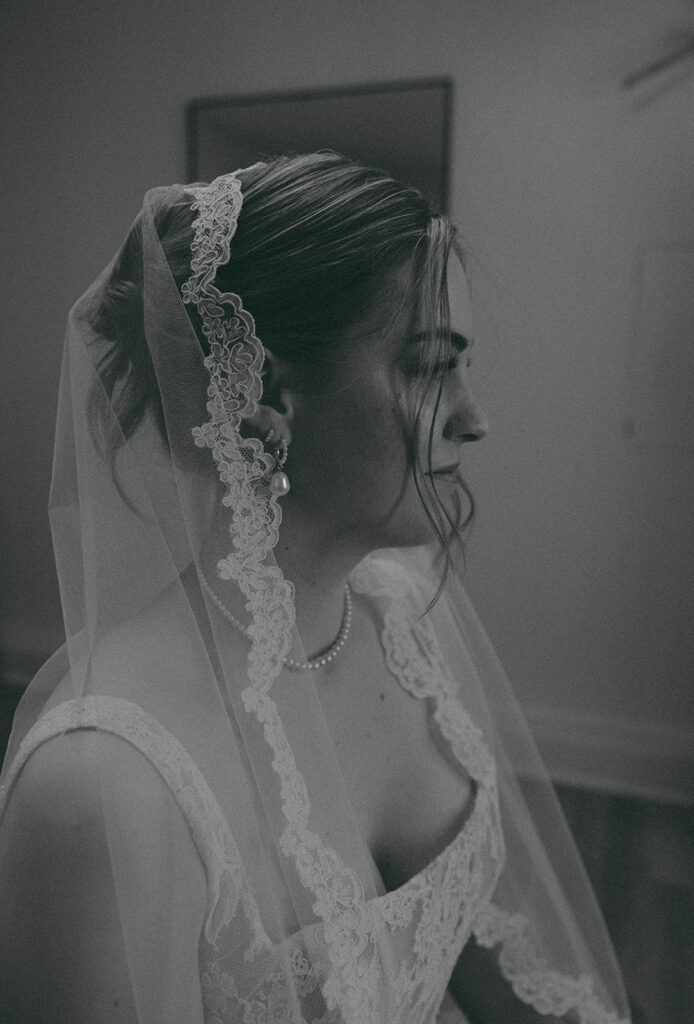 Romantic wedding scene featuring soft pastel florals, elegant decor, emotional couple moments, and guests celebrating in a light-filled venue inspired by Monet’s water lily paintings.