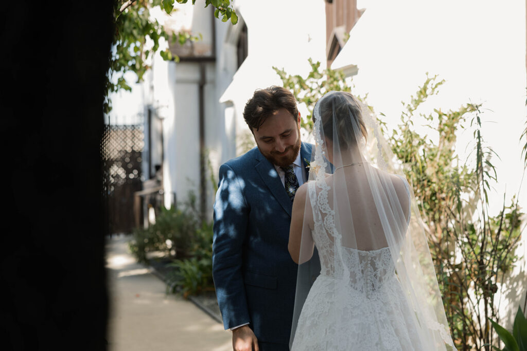 Romantic wedding scene featuring soft pastel florals, elegant decor, emotional couple moments, and guests celebrating in a light-filled venue inspired by Monet’s water lily paintings.